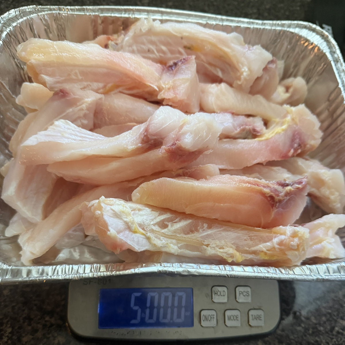 5 pounds of Buffalo Fish Ribs on a digital scale